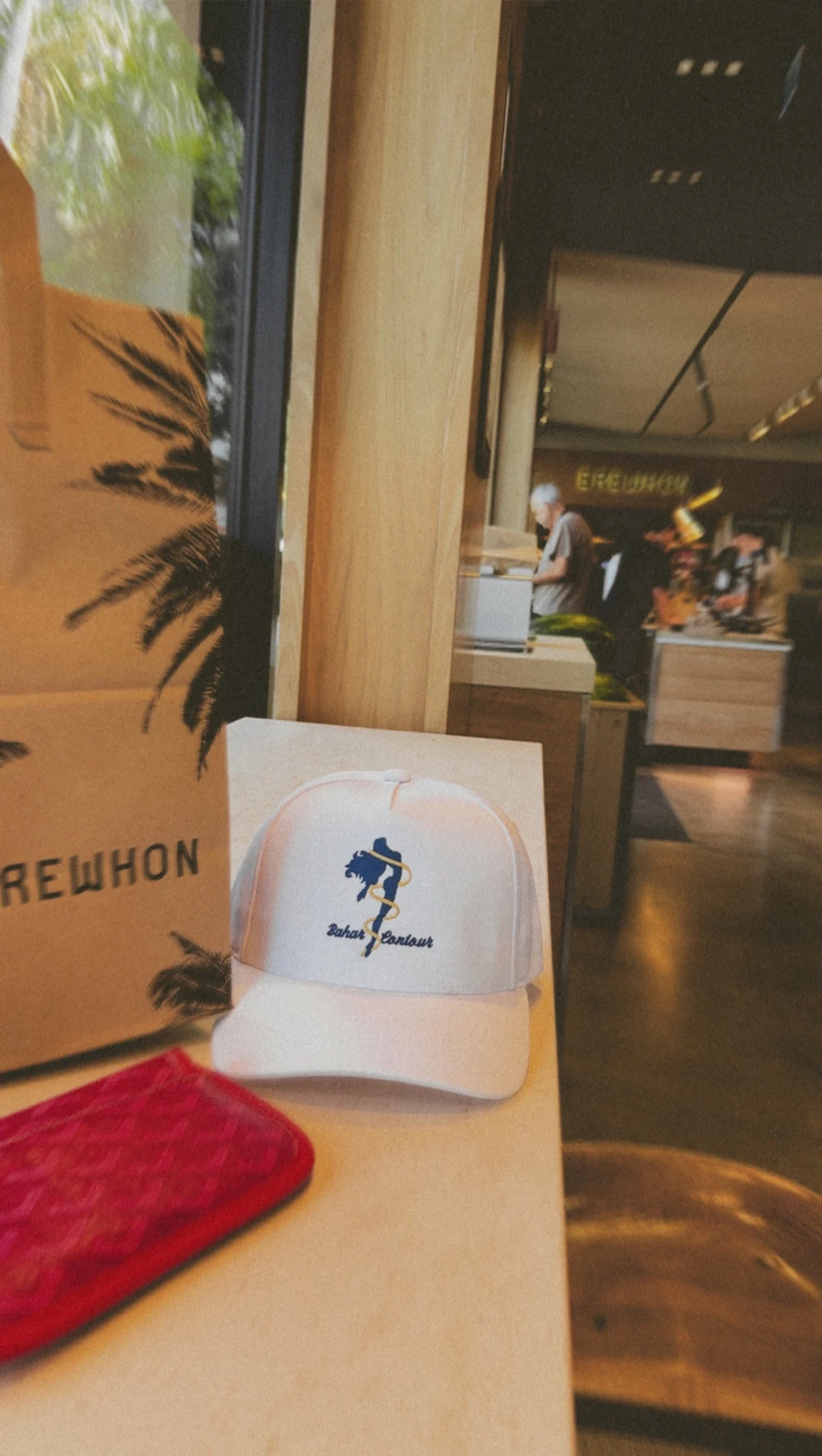 Bahar Contour embroidered cap displayed in a lifestyle setting