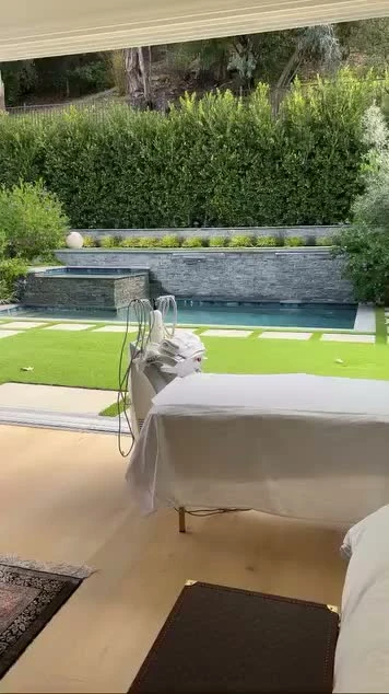 A private poolside patio with Bahar's treatment bed and equipment